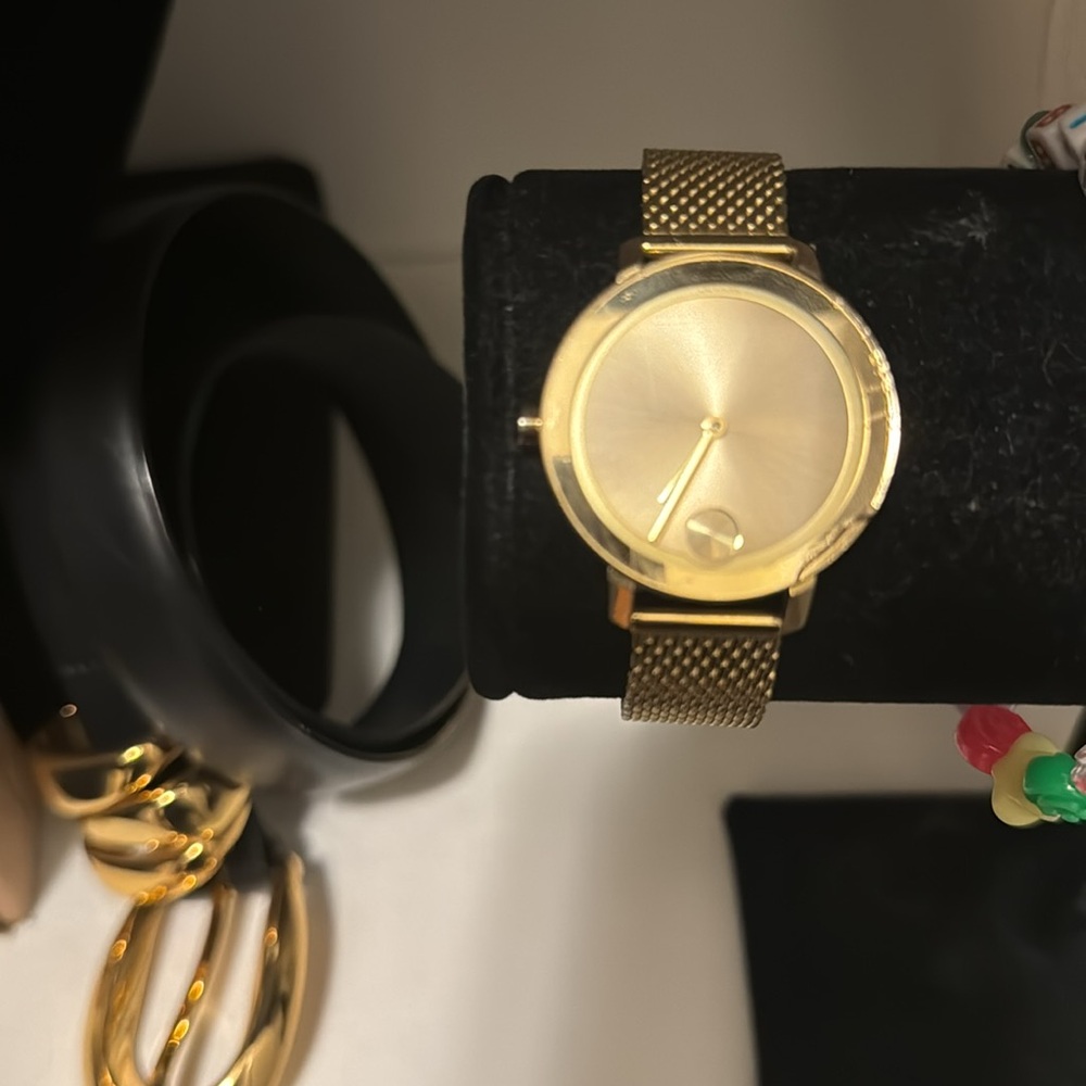 Movado Bold gold women’s watch. Chipped on face.